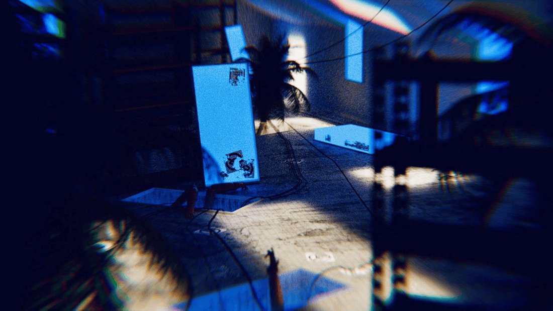 A blue-lit interior seen through heavy chromatic blur. Glowing panels lean against the walls, cables snake across a concrete floor, and a palm silhouette stands in the far light.